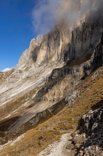 Wisps of clouds drift over the peaks