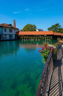 River Aare in City of Thun and Untere Schleuse Bridge in a Sunny Summer Day