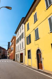 City Street in Porto Ceresio and Church Tower in a Sunny Summer Day in Porto Ceresio
