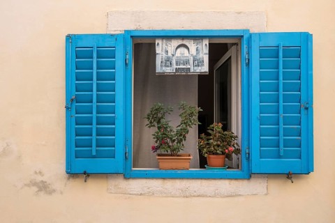 Window with blue shutters