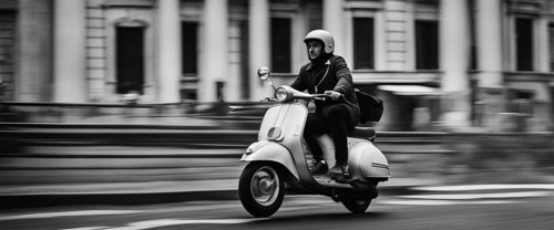 Italian elegant gentle man driving moped vintage scooter in Rome Italy at sunset traditional urban scene