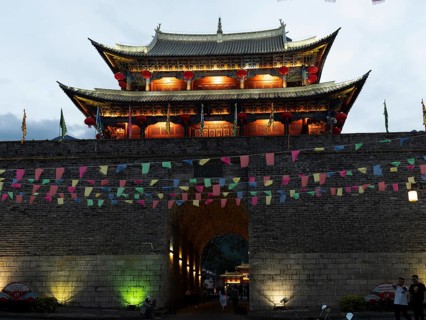 Old Chinese city gate with illuminated roofs
