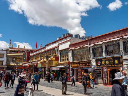 Pilgrims walk through the streets of Lhasa