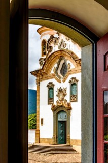 Baroque church facade seen through the window in the city of Mariana in the state of Minas Gerais