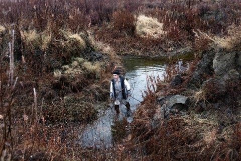 Scientist Sergei Zimov examines a varnish in an area where permafrost is rapidly thawing