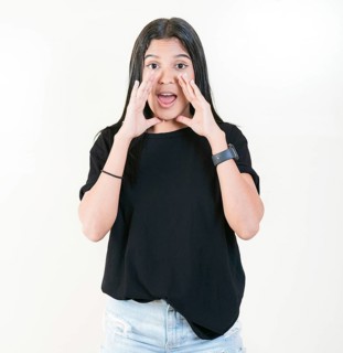 Young woman screaming and announcing at the camera. Young girl announcing something to the camera