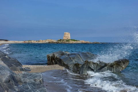Pedal boats on the beach in front of the Torre di Bari Sardo