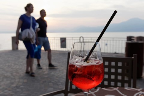 Sundowner Campari Sprizz on a table on the promenade