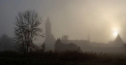 Church tower in the morning mist