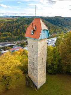Historic tower in the autumn forest