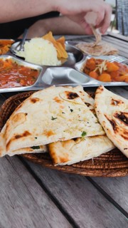 Tourist foodie eating vegetable curry or tarkari