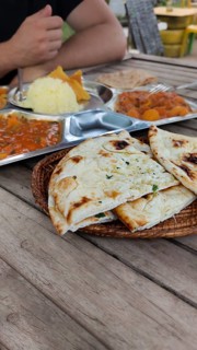 Tourist foodie eating vegetable curry or tarkari