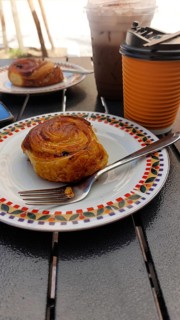 Cinnamon roll with coffee for take away
