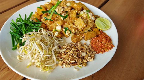 Overhead view of a plate of tofu pad thai