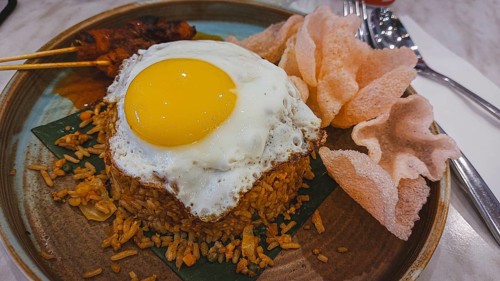Malaysian fried rice or nasi goreng with chicken satay