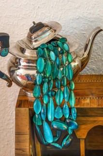 Jewellery necklace with silver teapot