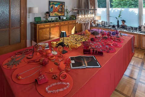 Jewellery decorated on a large table and chest of drawers