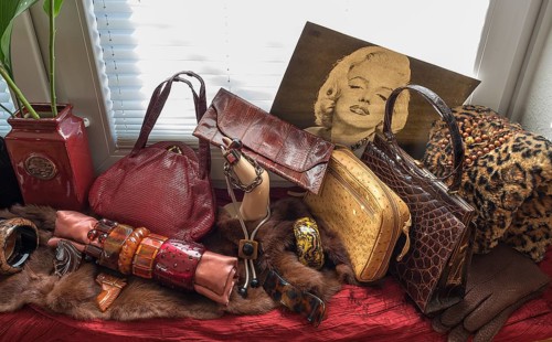 Bakelite jewellery and handbags decorated in front of a window