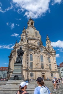 Tourists in front of the monument of the reformer Martin Luther
