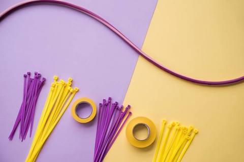 Arrangement insulating tape nylon zip wire purple yellow dual backdrop