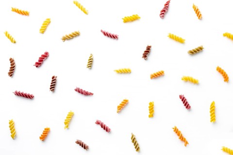 Arrangement uncooked colorful fusilli