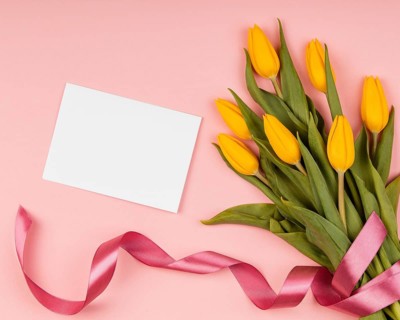 Assortment yellow tulips with empty card