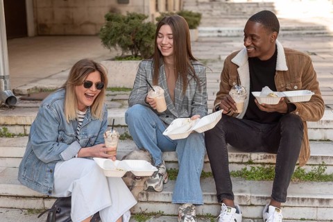 Best friends hanging out while enjoying cup coffee