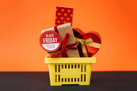 Black friday decoration with gifts shopping basket