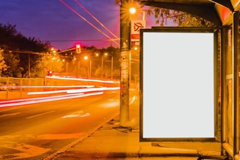 Blank billboard bus stop night