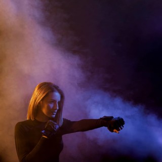 Boxing woman posing smoke