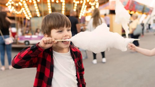 Boy enjoying cotton candy