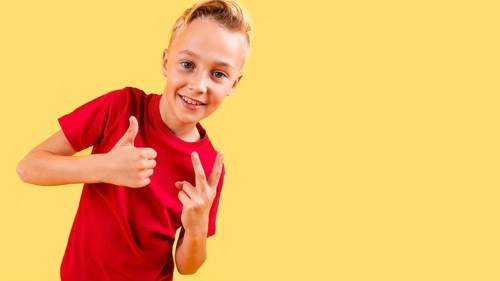 Boy showing ok sign peace with copy space