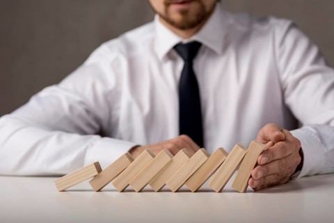 Businessman with tie dominoes