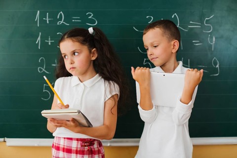 Classmates blackboard math lesson