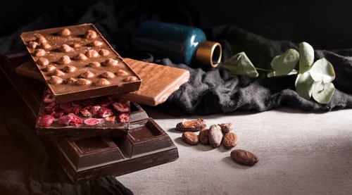 Close up chocolate bars with cocoa beans