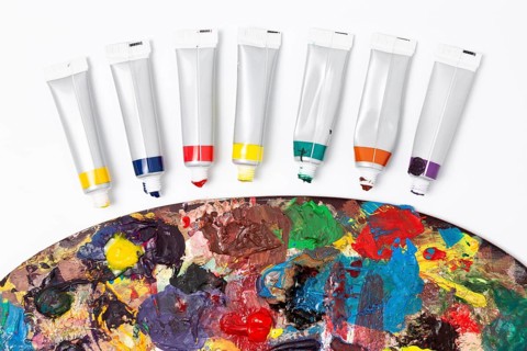 Close up dirty color palette watercolour tubes