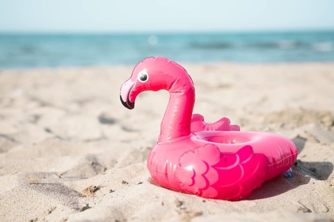 Close up inflatble flamingo swim ring beach