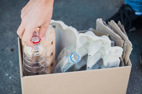 Close up plastic bottles egg carton box
