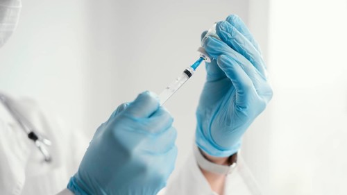 Doctor getting ready vaccine patient