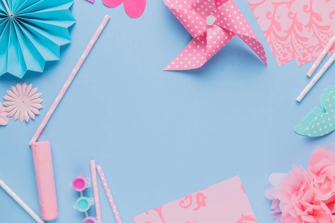 Elevated view origami crafts art straw blue background