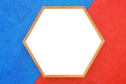 Empty wooden hexagon frame red blue background