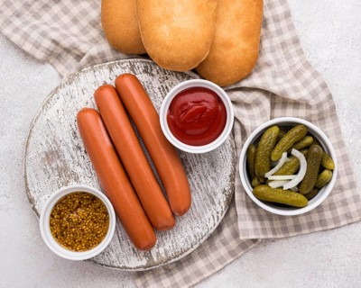 Flat lay sausage with buns sauce