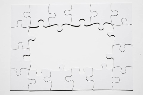 Frame made from white puzzle piece white background