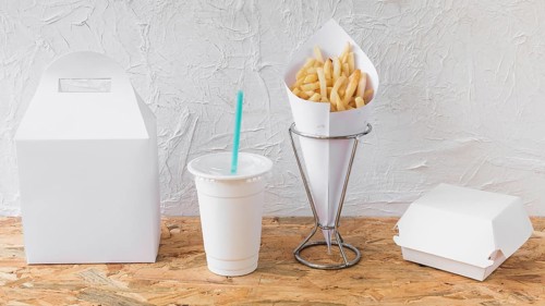 French fries disposal cup packages wooden desk