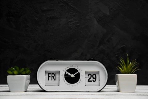 Front view clock bulbs with wooden table