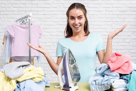 Front view woman ready ironing clothes
