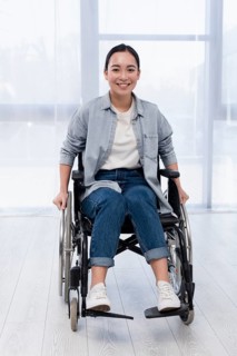 Full shot happy woman wheelchair