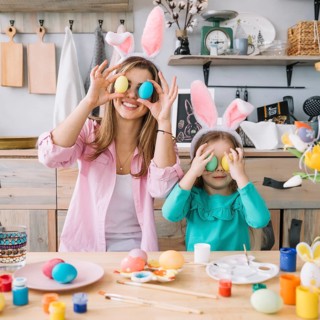 Girl mother holding easter eggs eyes