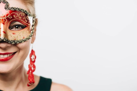 Happy woman bright red carnival mask
