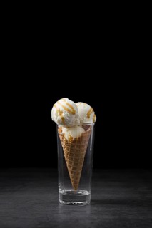 High angle ice cream cone served glass